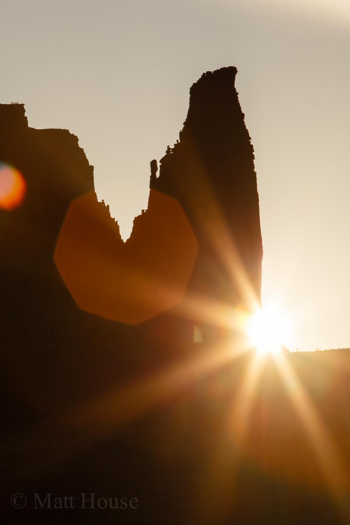 The sun rising behind The Titan
