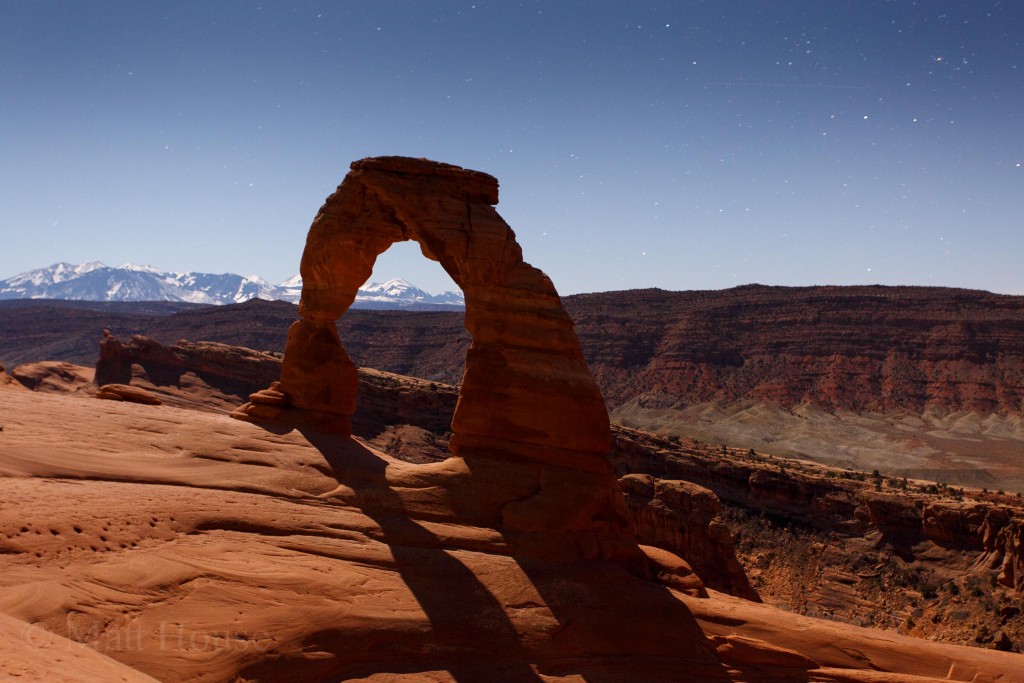 Delicate Arch and the La Sal Mountains by moonlight