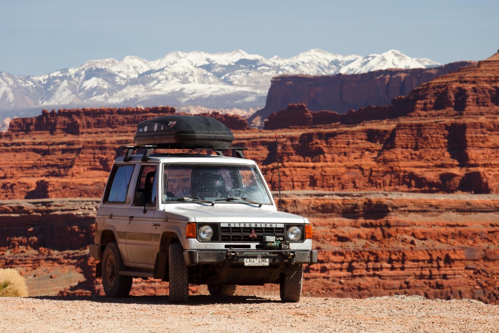 Montero in front of the La Sals. Parked on the edge of a cliff.